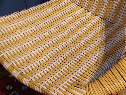 Yellow and white woven plastic armchair,...