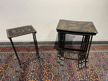 Set of four nesting tables in black lacquered...