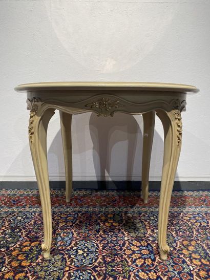 Round table in molded, carved and cream and...