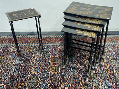 Set of four nesting tables in black lacquered...
