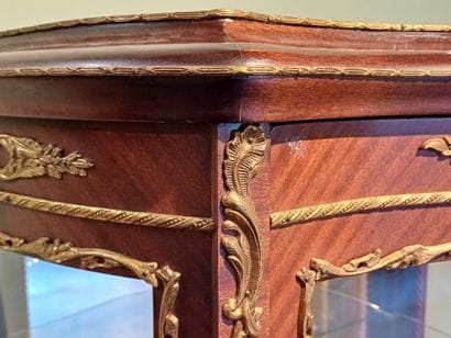 A three-sided-glazed, curved display case...