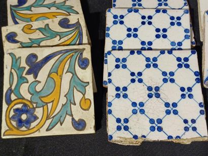 Set of 14 earthenware tiles with blue or...