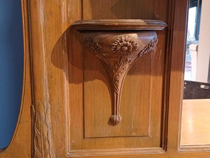 Wooden sideboard carved with flowers, the...