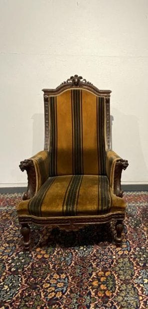 Oak armchair with carved Indian head, lion's...
