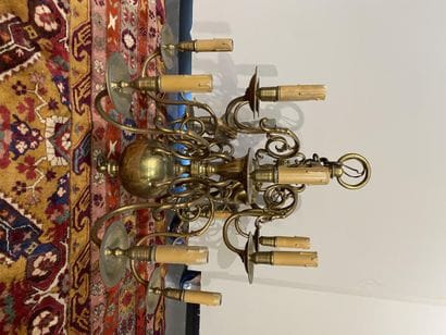 Twelve-light brass chandelier on two rows....