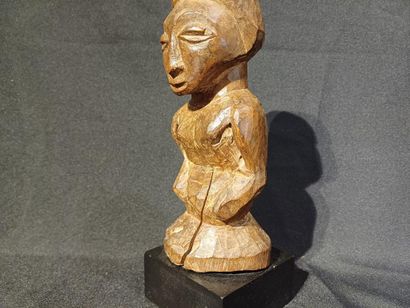 Carved wooden fetish.
Republic of Congo,...