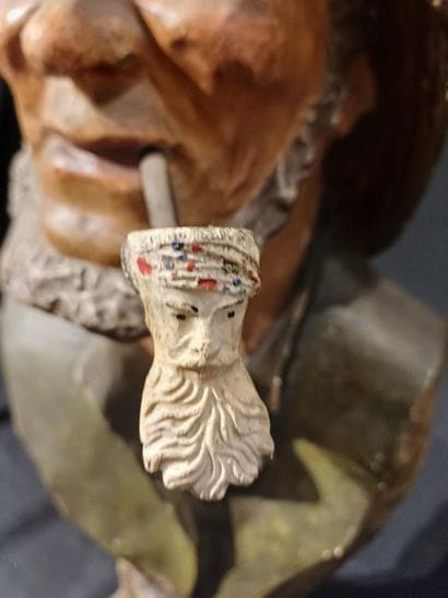 Polychrome patinated plaster bust of a man...