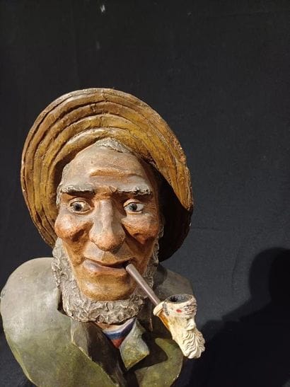 Polychrome patinated plaster bust of a man...