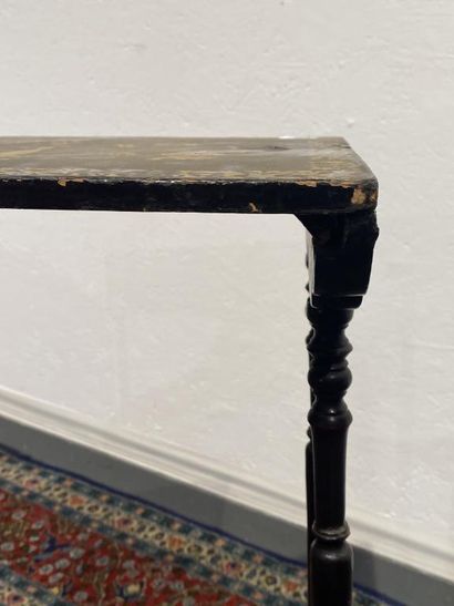 Set of four nesting tables in black lacquered...