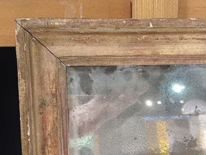Small mirror in wood and gilded stucco. 
19th...
