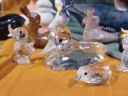 Collection of figurines representing birds...
