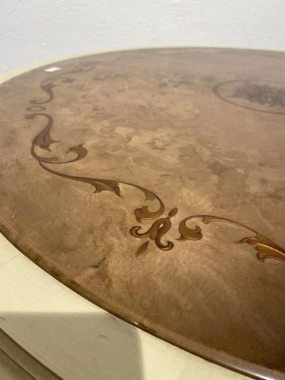 Round table in molded, carved and cream and...