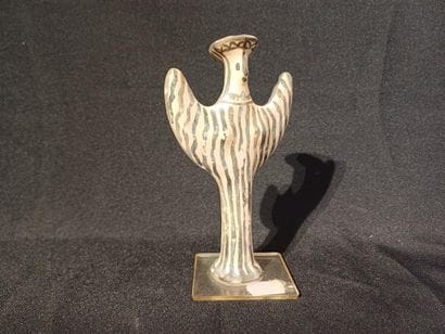 Terracotta statuette with painted decoration...