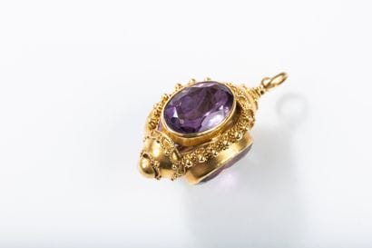 Gold pendant featuring a lantern set with...