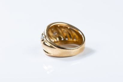 Yellow and white gold band ring decorated...
