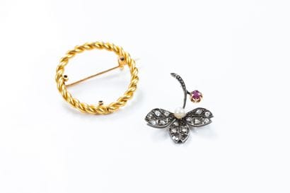 Brooch holding a removable silver floral...