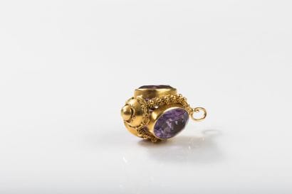 Gold pendant featuring a lantern set with...