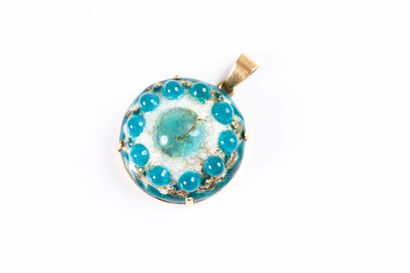 Yellow gold pendant adorned with a blue and...