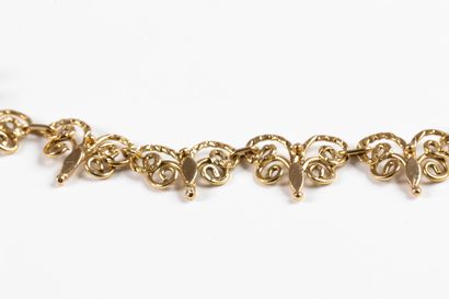 Yellow gold choker necklace centered with...