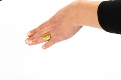Yellow gold ring set with a curved Napoleon...