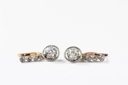 Pair of earrings adorned with three diamonds...