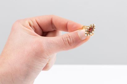 Yellow gold marquise ring centered with a...