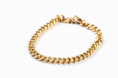Yellow gold curb chain bracelet with chased...