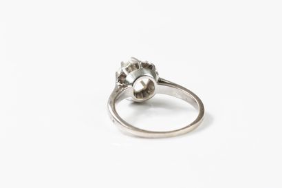 White gold and platinum solitaire ring centered...