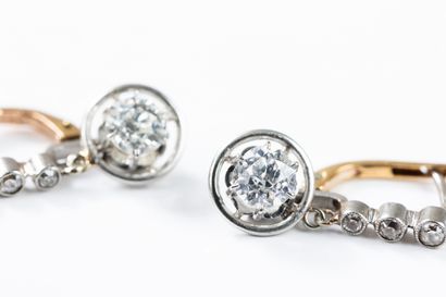 Pair of earrings adorned with three diamonds...