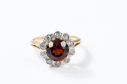 Yellow gold and platinum daisy ring centered...