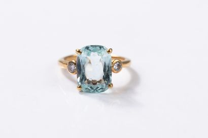 Yellow gold ring centered on an aquamarine...