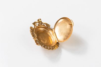 Medallion pendant topped with a pearl in...