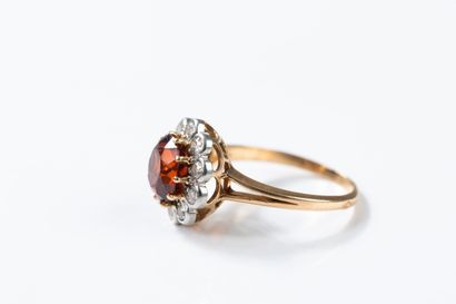 Yellow gold and platinum daisy ring centered...
