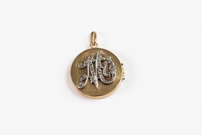 Circular, opening pendant in yellow gold...