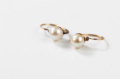 Pair of gold sleeper earrings, each punctuated...
