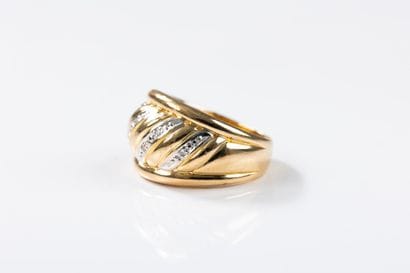 Yellow and white gold band ring decorated...