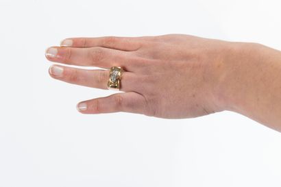 Gold tank ring centered with a line of old-cut...