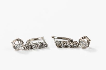 Pair of dangling earrings in white gold adorned...
