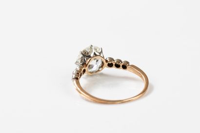 Gold and platinum ring centered on an old-cut...