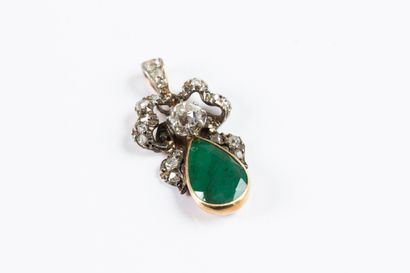 Gold and silver pendant adorned with a drop...