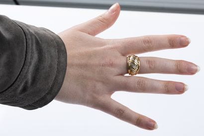 Yellow and white gold band ring decorated...
