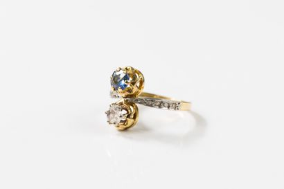 toi et moi gold ring set with a round sapphire...