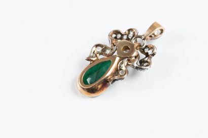 Gold and silver pendant adorned with a drop...