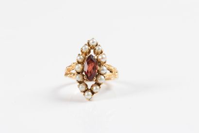 Yellow gold marquise ring centered with a...