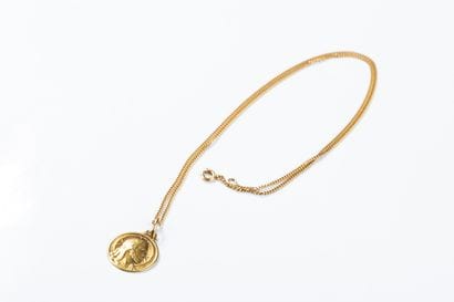 Gold chain with a gold medal depicting Christ...