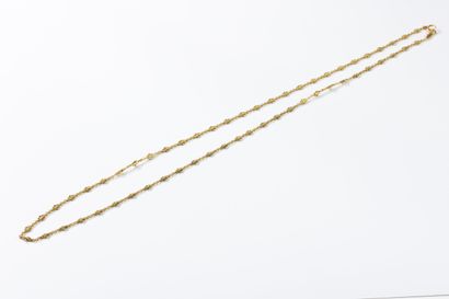 Gold long necklace with geometric decoration...