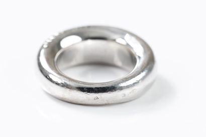 CHAUMET 
Large white gold band ring inscribed...
