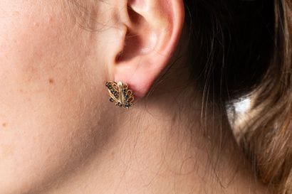 Pair of gold earrings set with sapphires...