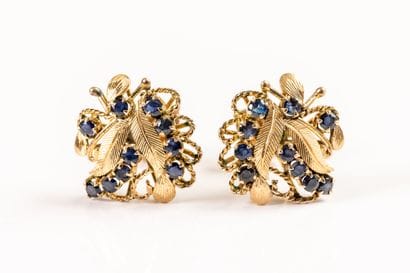 Pair of gold earrings set with sapphires...