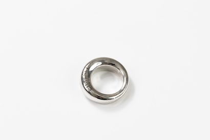 CHAUMET 
Large white gold band ring inscribed...